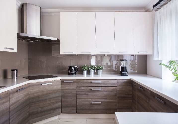 Small kitchen with dark brown and white cabinets