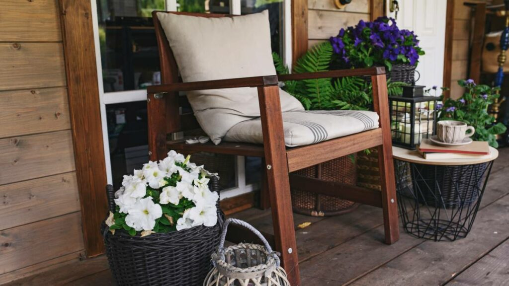 a wooden chair on a front or back verandah