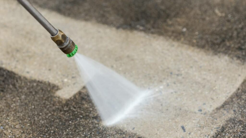 cleaning an outdoor flooring with a power washer